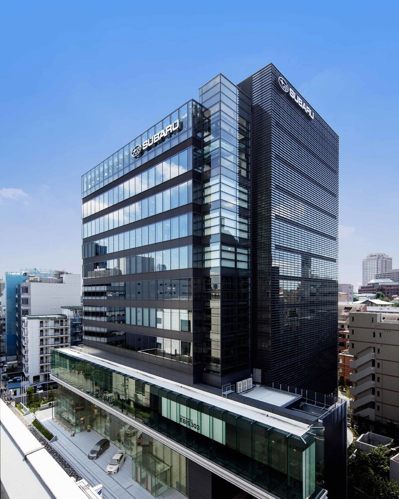 Subaru Corporation headquarters in Tokyo, Japan. A modern glass high-rise with