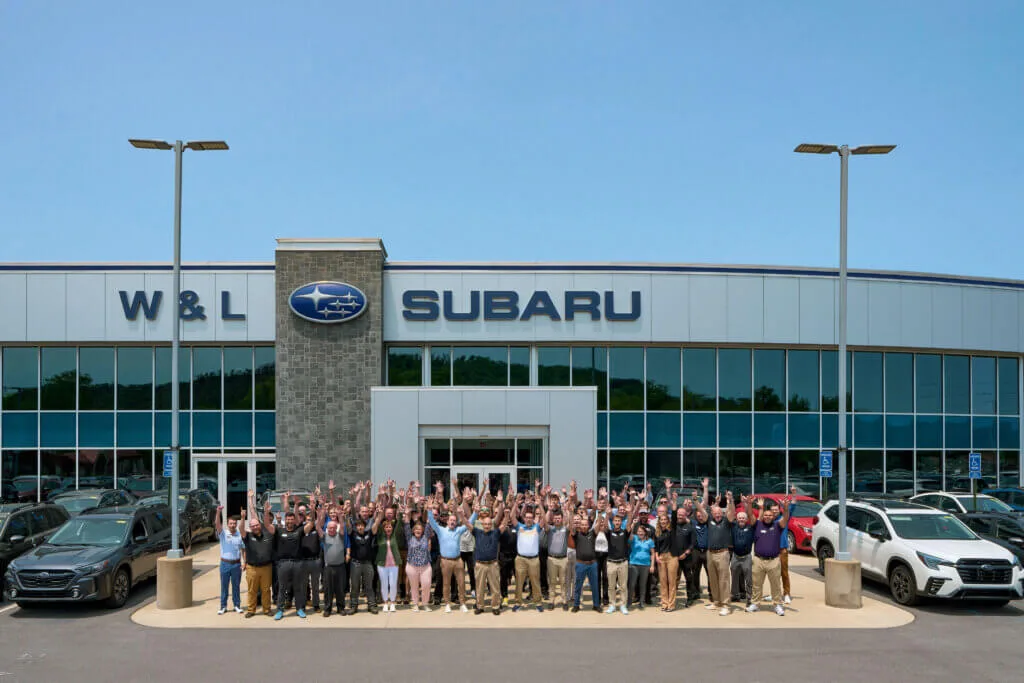 W&L Subaru team members standing outside the dealership.