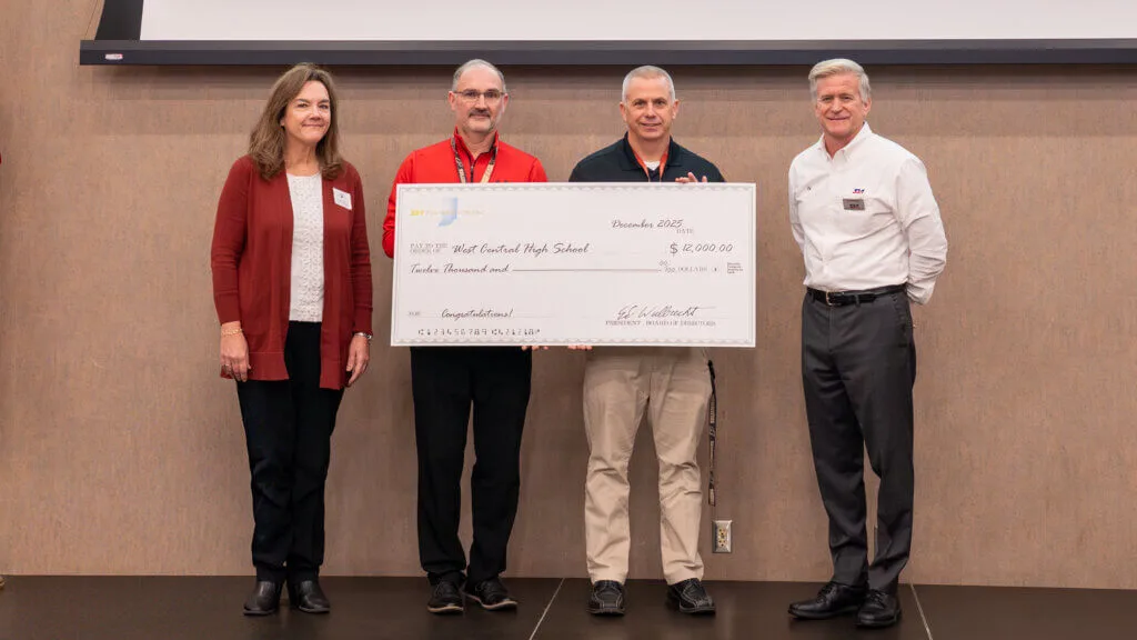 SIA Foundation representatives presenting a grant check to West Central High School.