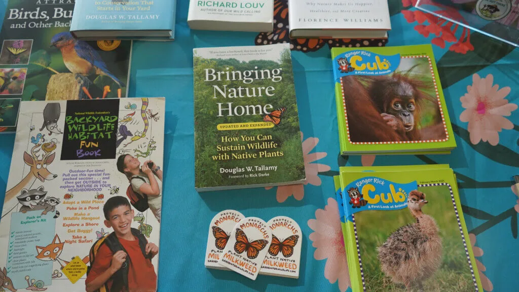 Nature and wildlife education books displayed at Subaru's Earth Day event